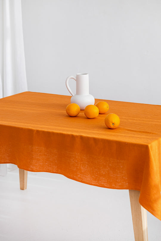 Table Covered With Linen Tablecloth In Mustard Color 2