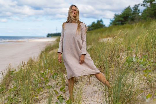 Model Demonstrates Linen Oversized Dress AURA Natural Color In Beach 3 - Daily Linen
