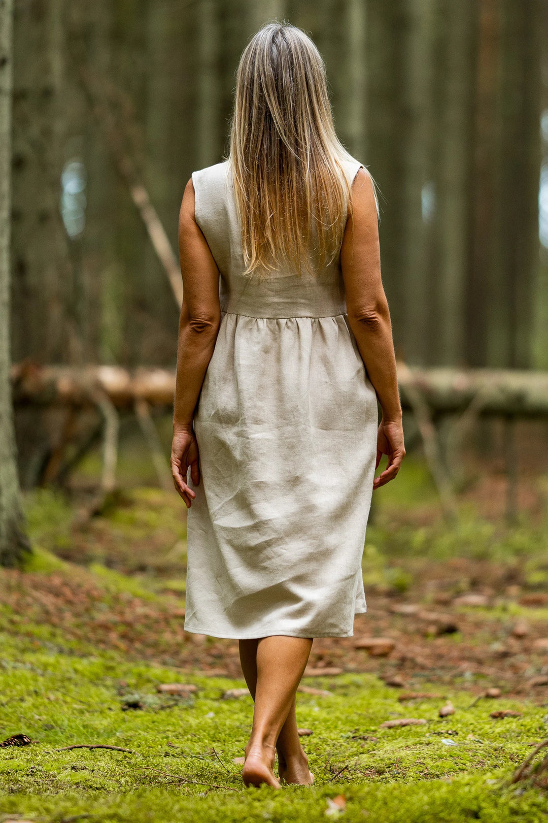 Model In Forest Wears Linen Sleeveless Dress Barbara In Natural Color View From Back - Daily Linen