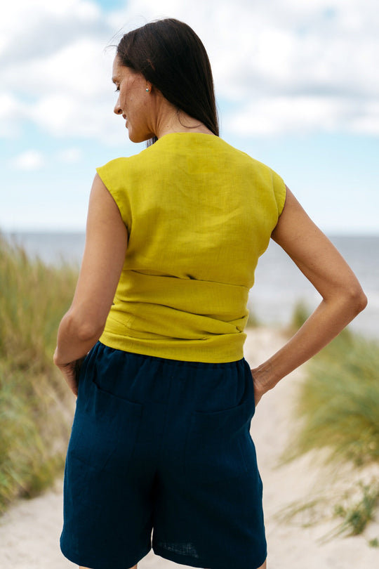 Model Demonstrates Sleeveless Linen Wrap Top Julia in Yellow Color Back View - Daily Linen