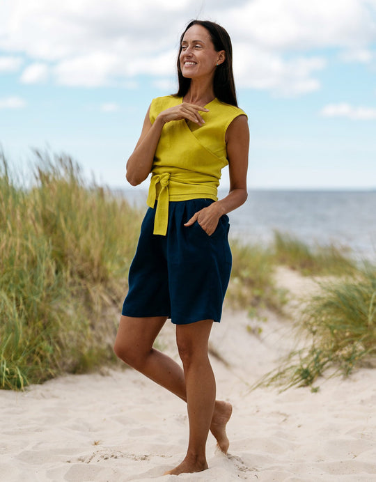 Model Demonstrates Sleeveless Linen Wrap Top Julia in Yellow Color Side View - Daily Linen