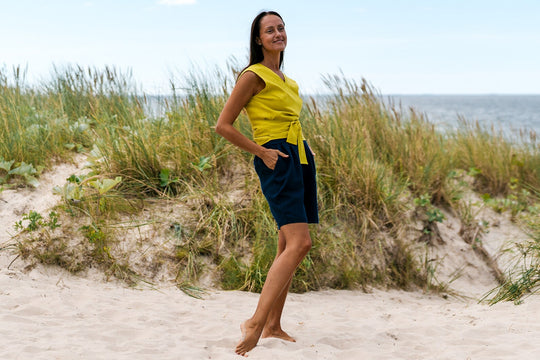 Model Demonstrates Sleeveless Linen Wrap Top Julia in Yellow Color Front Side View - Daily Linen