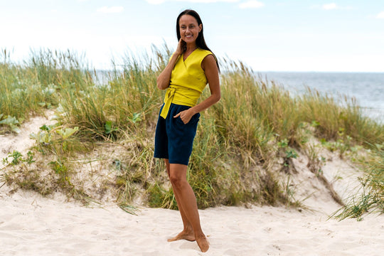 Model Demonstrates Sleeveless Linen Wrap Top Julia in Yellow Color From Side - Daily Linen