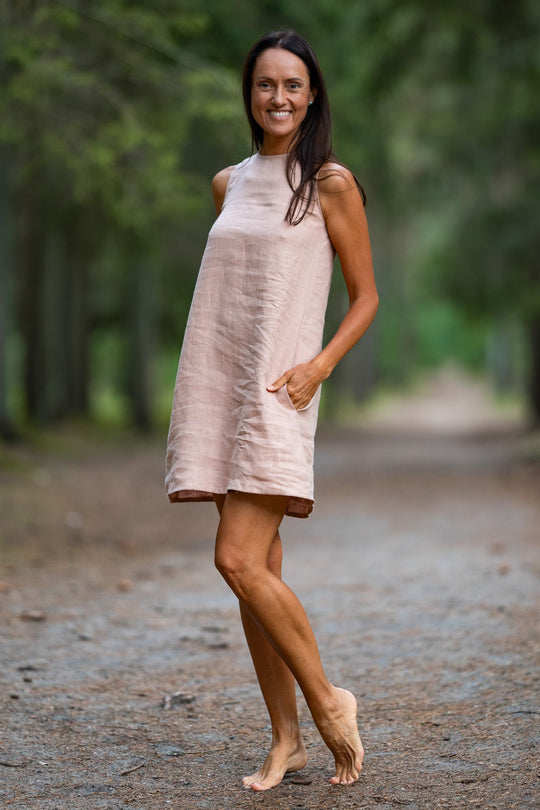 Model In Forest Demonstrates Linen Dress Victoria In Powder Color 1 - Daily Linen