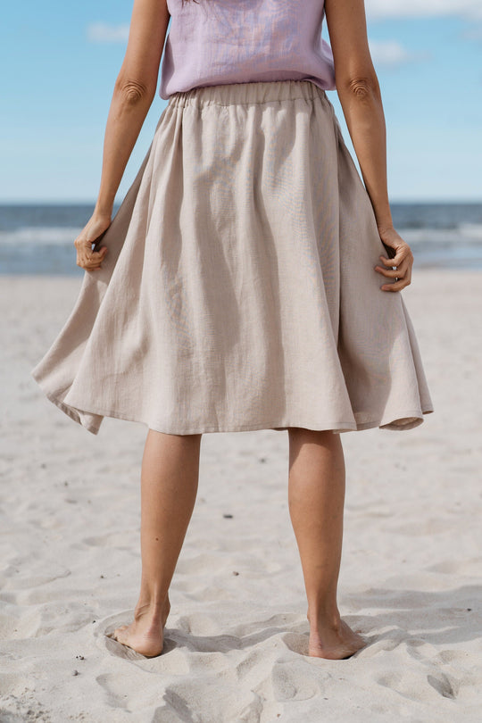 women shows back of linen skirt