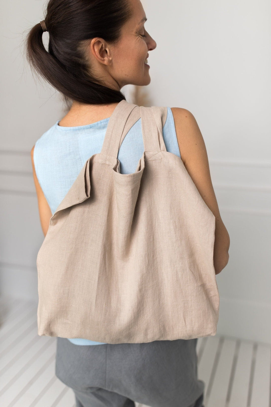 Model Demonstrates Daily Linen Tote Bag In Natural Color