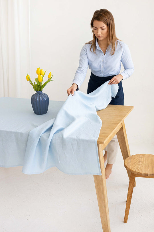 Women Serves Table With Linen Tablecloth In Sky Blue Color 1 - Daily Linen
