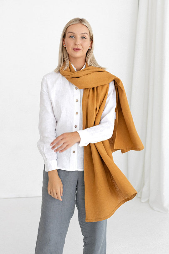 Model wears linen scarf in amber yellow color made by Daily Linen
