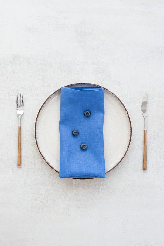 Blue linen napkins with bilberries