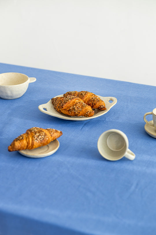 Blue linen tablecloth with croissants