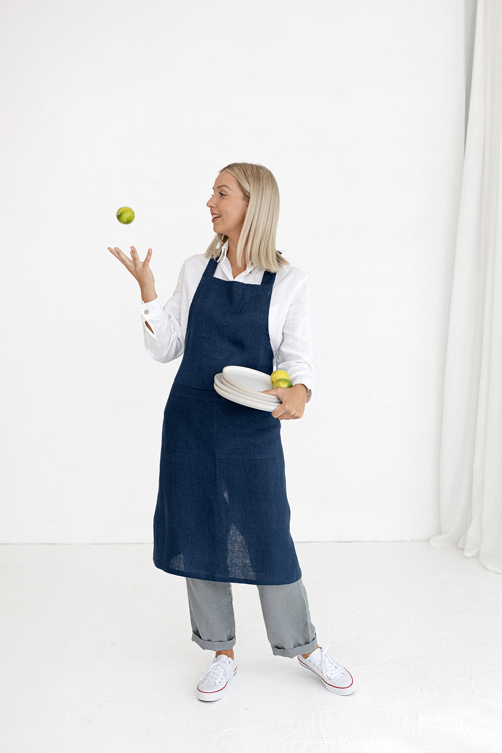 Model Wears Linen Bib Apron In Midnight Blue Color Made By Daily Linen 1