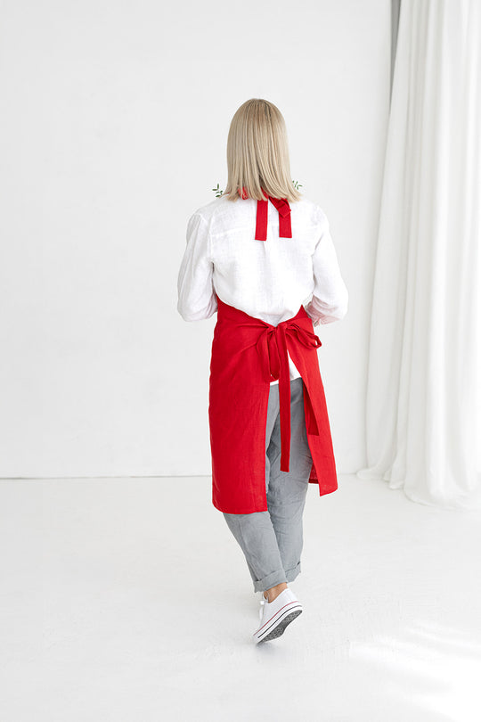 Women wears linen bib apron in red color made by Daily Linen 2