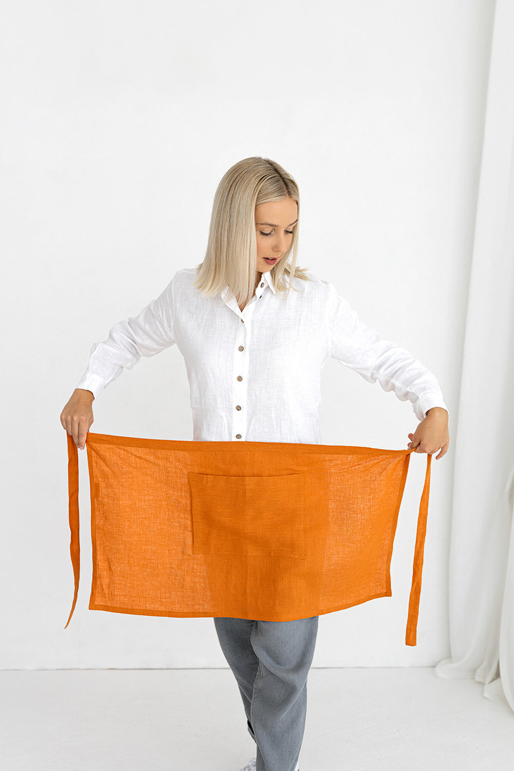 Model Demonstrates Linen Half Apron In Mustard Color Made By Daily Linen 1