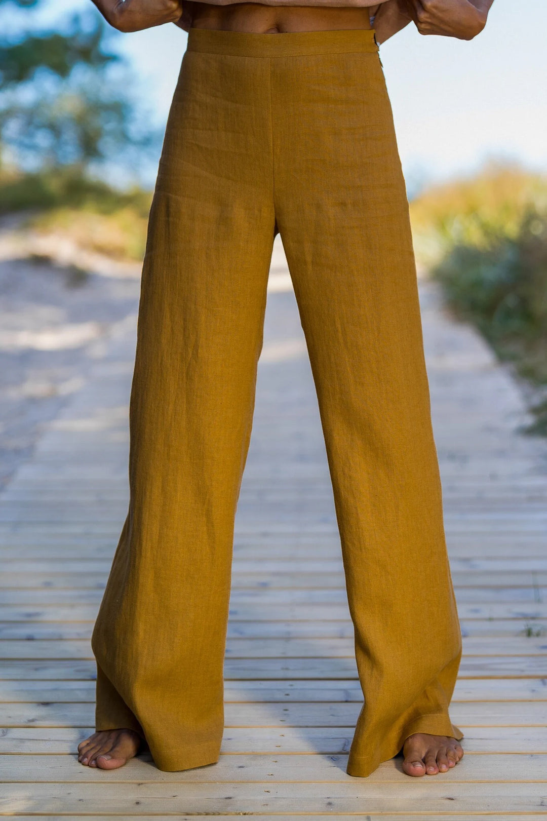Model Wears Linen Palazzo Pants Klara In Amber Yellow Color - Daily Linen