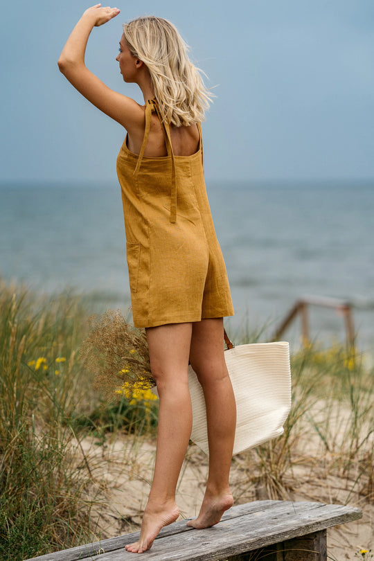 Model Wears Linen Playsuit Panama In Amber Yellow Color 5 - Daily Linen