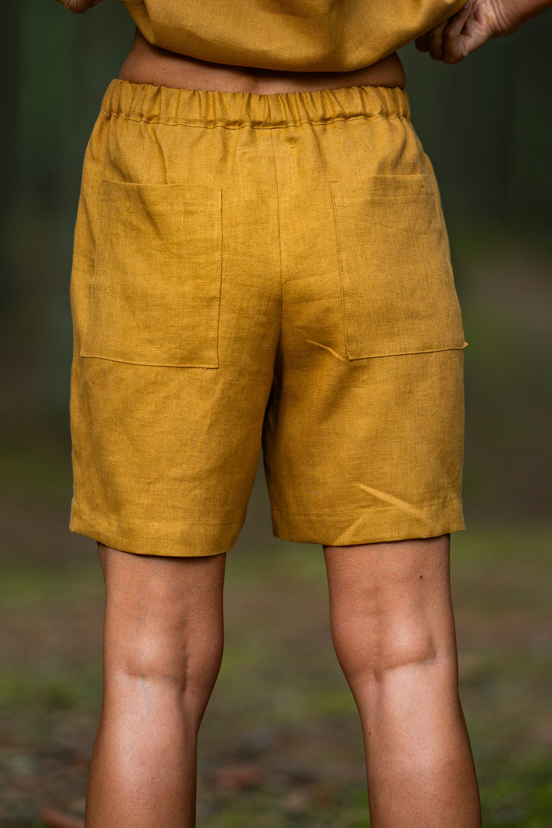 Women Wears Linen Pleated Shorts Bergen In Amber Yellow Color 2 - Daily Linen
