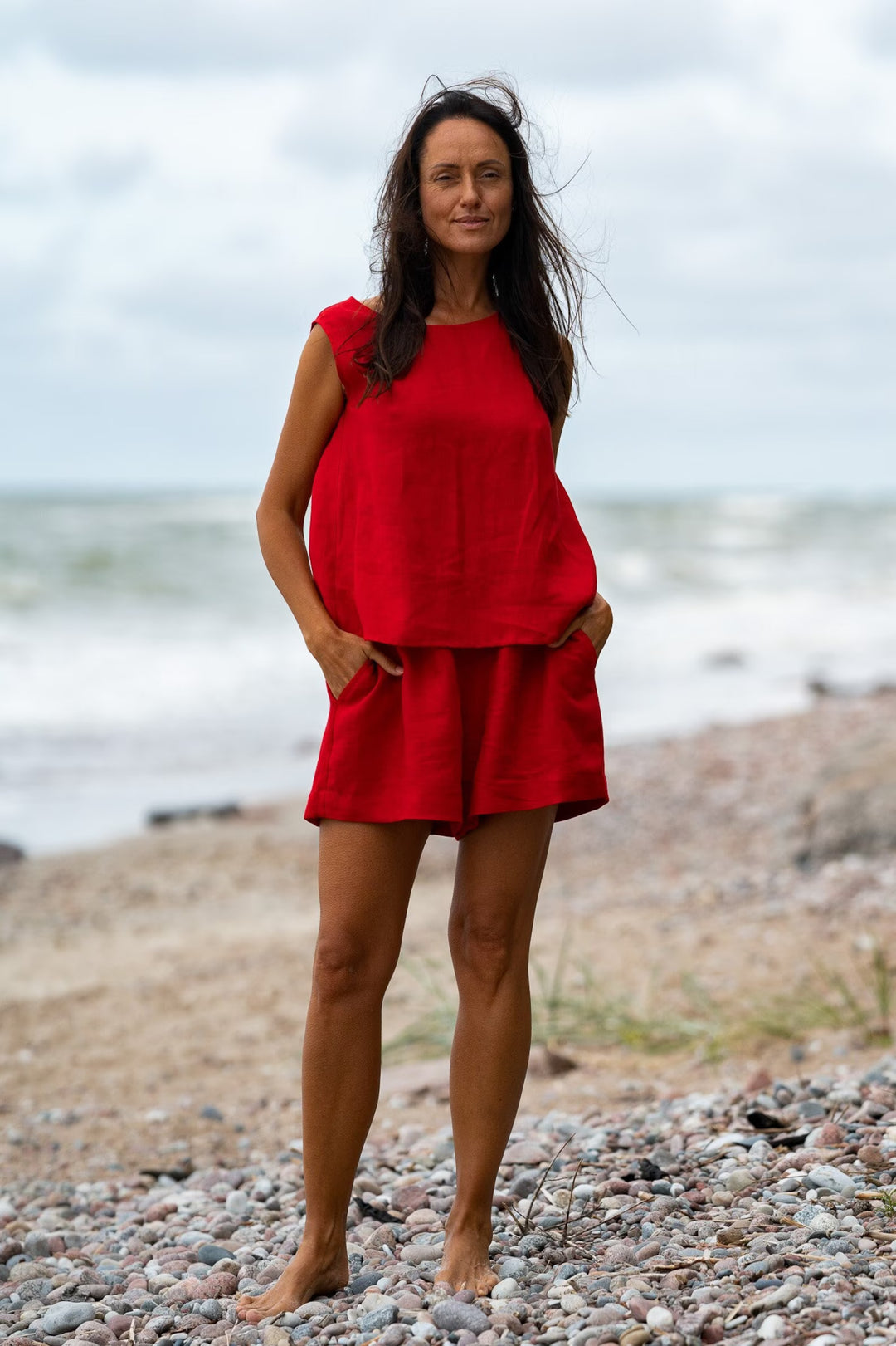 Model In Beach Demonstrates Linen Tank Top Teide In Red Color - Daily Linen