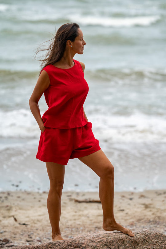 Model In Beach Demonstrates Linen Tank Top Teide In Red Color 3 - Daily Linen