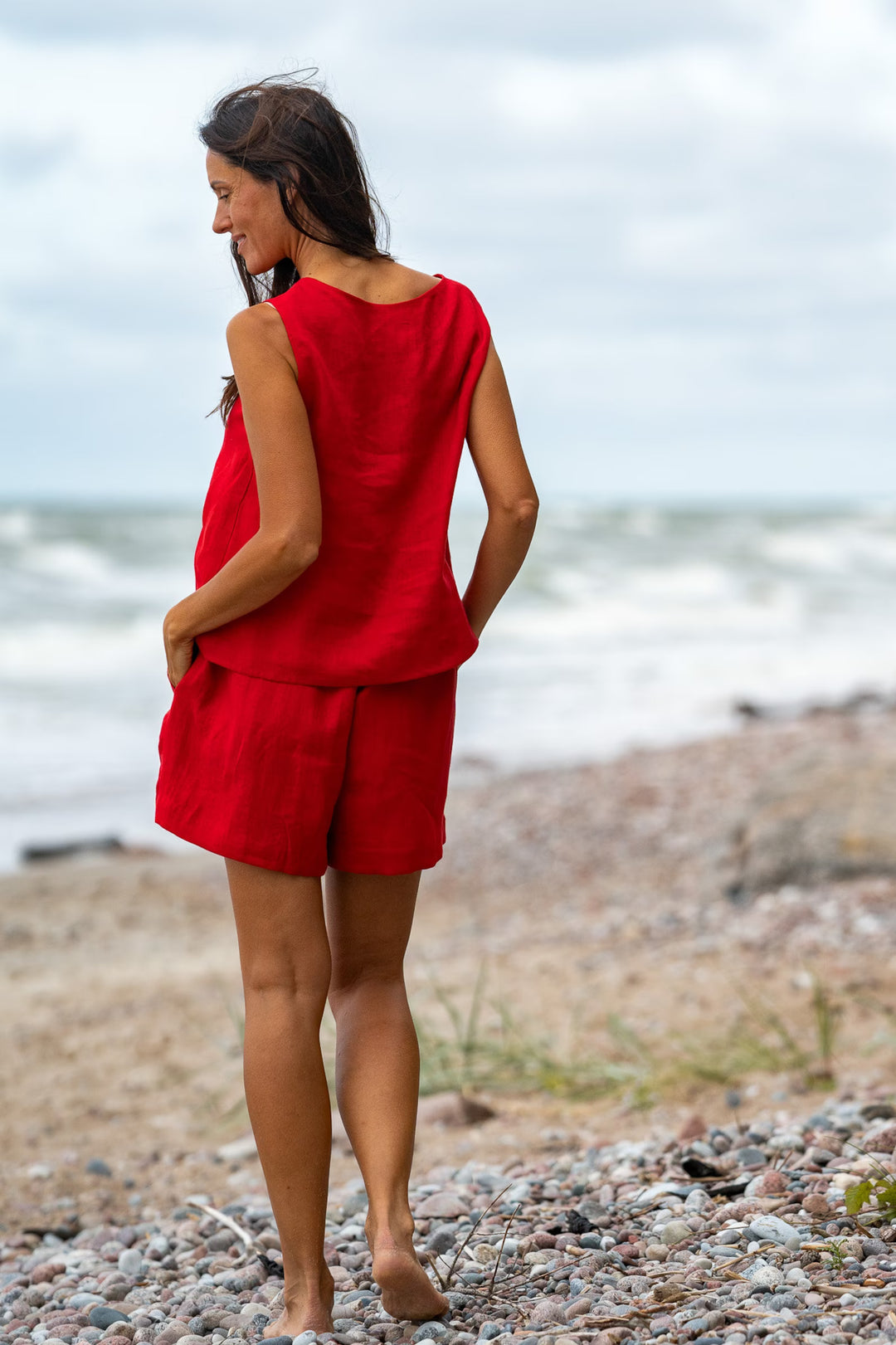 Model In Beach Demonstrates Linen Tank Top Teide In Red Color 4 - Daily Linen