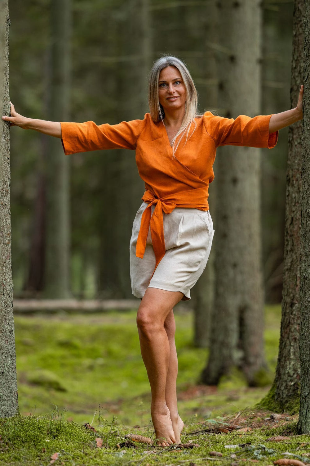 Women In Forest Demonstrates Linen Wrap Top Madeira In Mustard Color 1 - Daily Linen