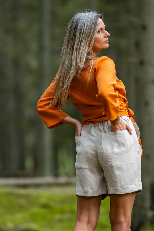 Women In Forest Demonstrates Linen Wrap Top Madeira In Mustard Color 3 - Daily Linen