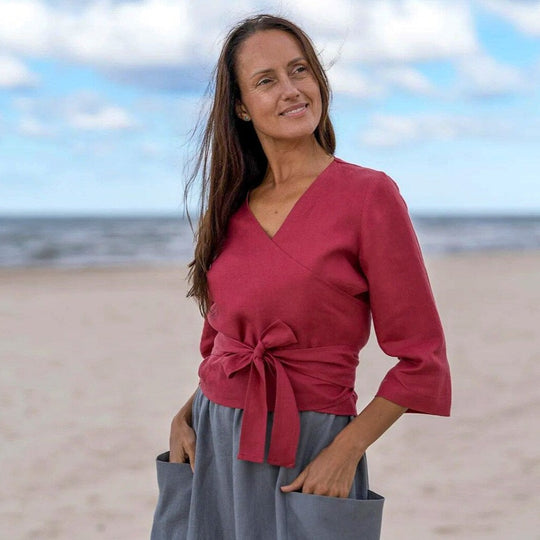 Model In Beach Demonstrates Linen Wrap Top Madeira In Raspberry Color - Daily Linen