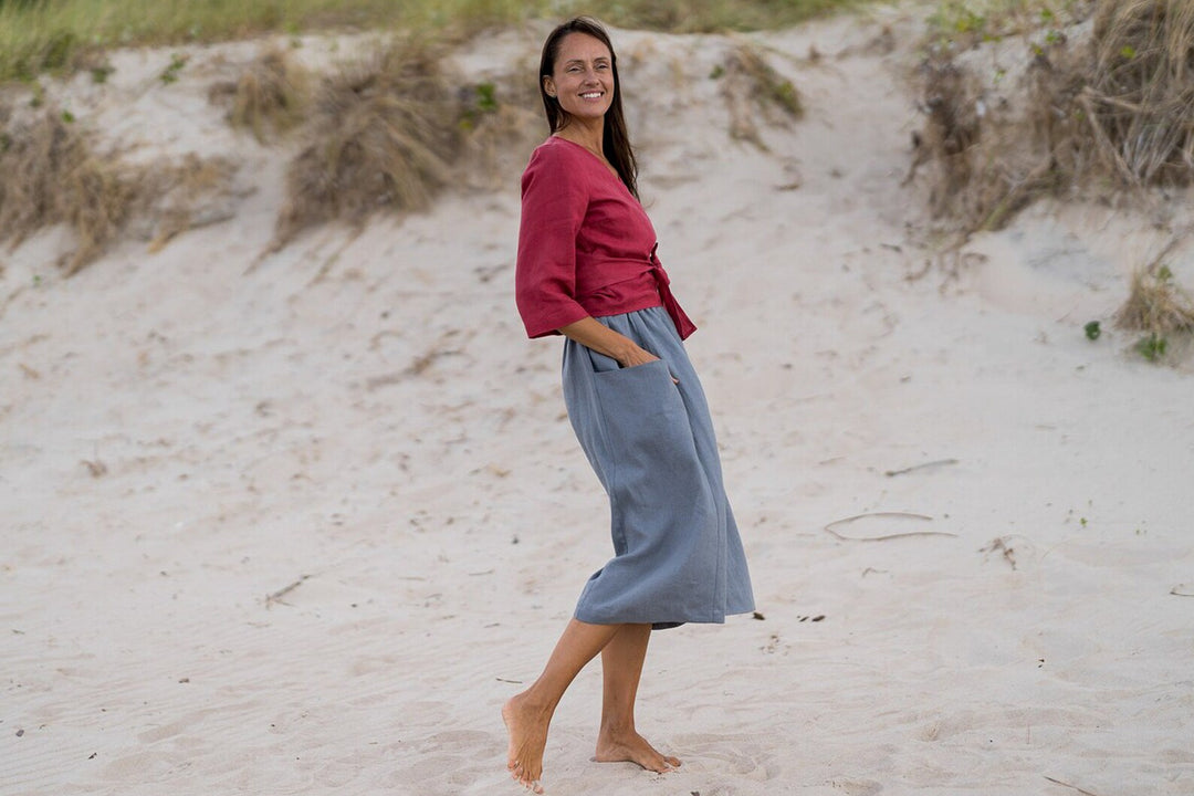 Model In Beach Demonstrates Linen Wrap Top Madeira In Raspberry Color 3 - Daily Linen