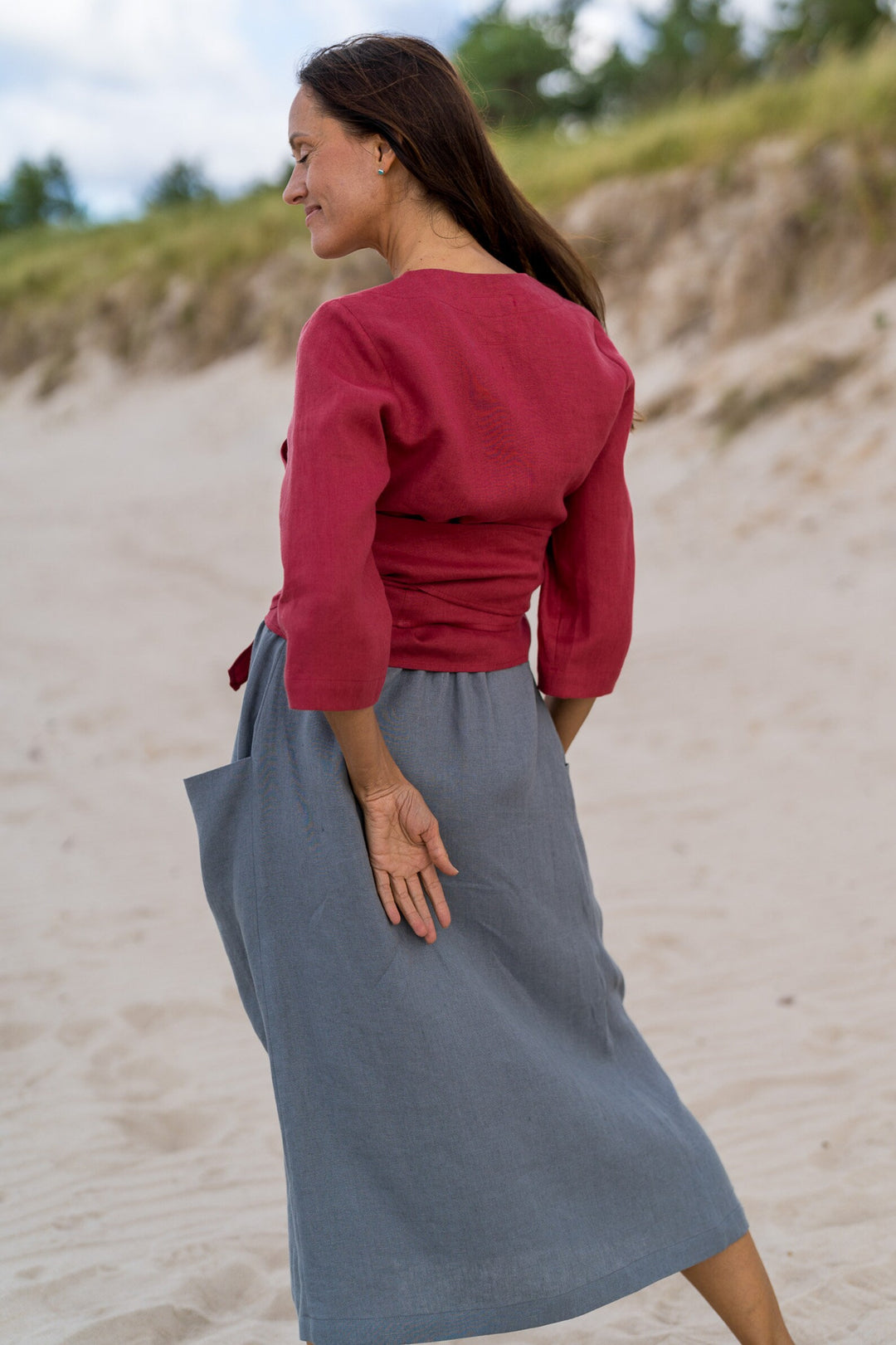 Model In Beach Demonstrates Linen Wrap Top Madeira In Raspberry Color 4 - Daily Linen