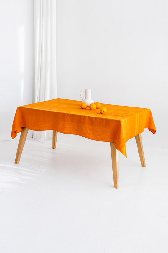Table Covered With Linen Tablecloth In Mustard Color