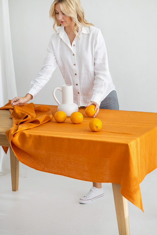 Table Covered With Linen Tablecloth In Mustard Color 1