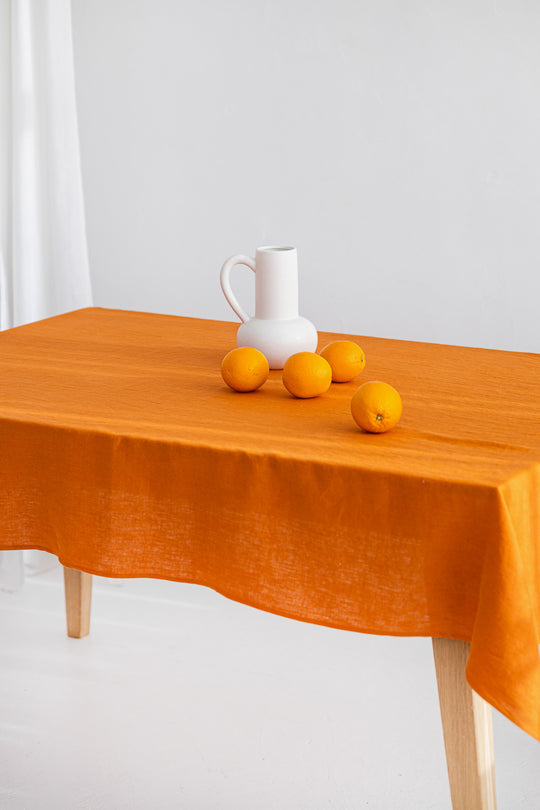 Table Covered With Linen Tablecloth In Mustard Color 2