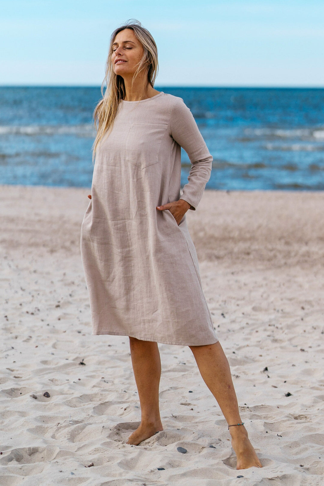 Model Demonstrates Linen Oversized Dress AURA Natural Color In Beach - Daily Linen