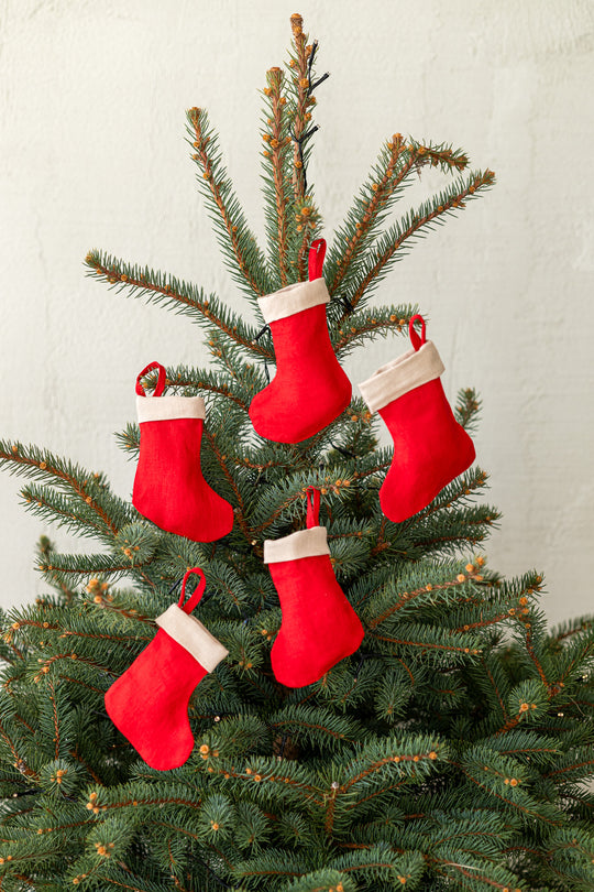 Set Of 5 Linen Christmas Stockings In Red Color Hanging On Tree - Daily Linen