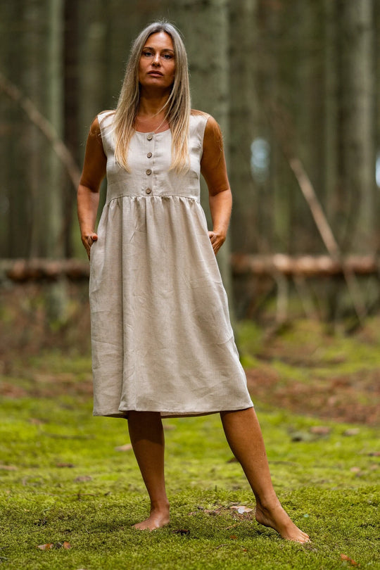 Model In Forest Wears Linen Sleeveless Dress Barbara In Natural Color - Daily Linen