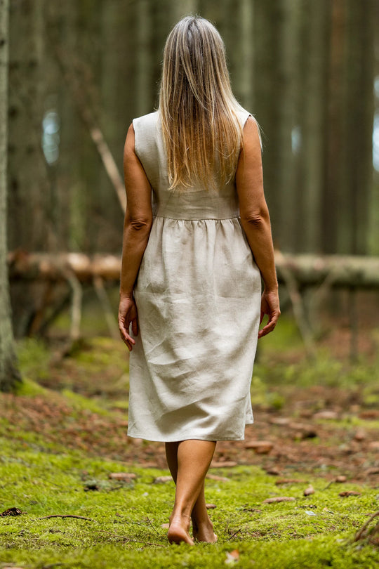 Model In Forest Wears Linen Sleeveless Dress Barbara In Natural Color View From Back - Daily Linen
