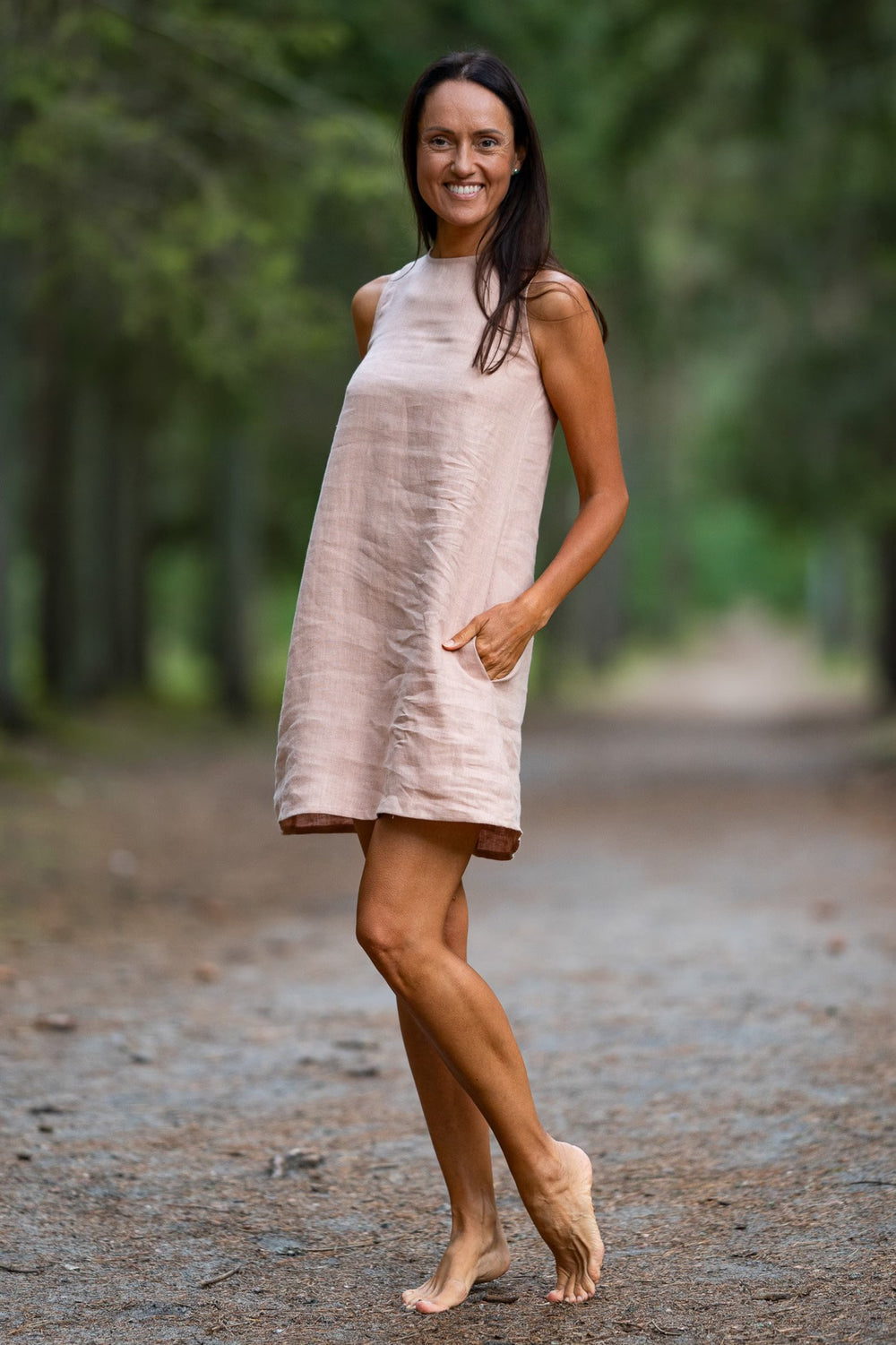Model In Forest Demonstrates Linen Dress Victoria In Powder Color 1 - Daily Linen