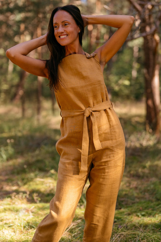 Model Wears Linen Jumpsuit Dicey In Amber Yellow Color - Daily Linen