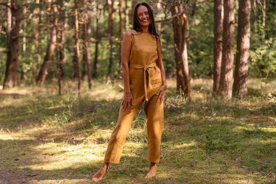 Model Wears Linen Jumpsuit Dicey In Amber Yellow Color 5 - Daily Linen