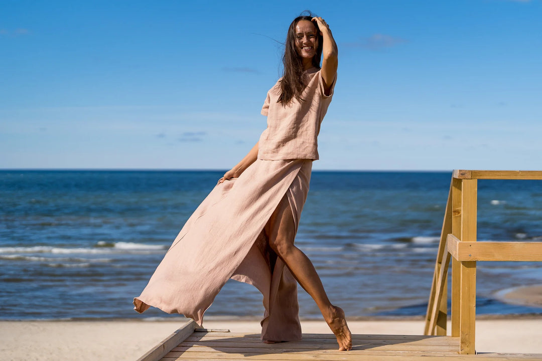 Model In Beach Demonstrates Linen Wrap Maxi Skirt In Powder Color 3 - Daily Linen