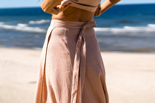 Model In Beach Demonstrates Linen Wrap Maxi Skirt In Powder Color 7 - Daily Linen