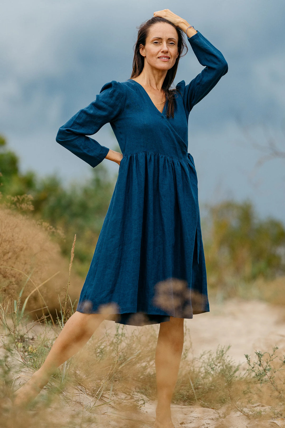 Model Wears Wrap Linen V Neck Dress Venice In Blue Color 