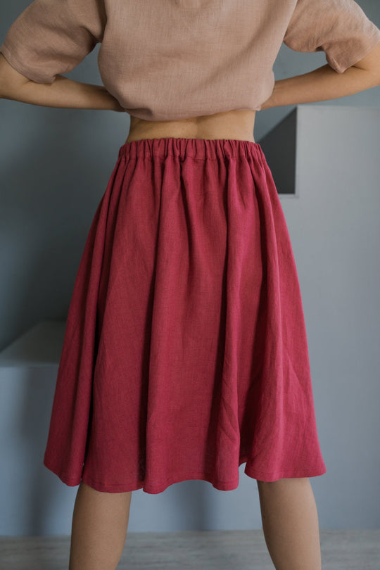 Women shows back of  linen skirt