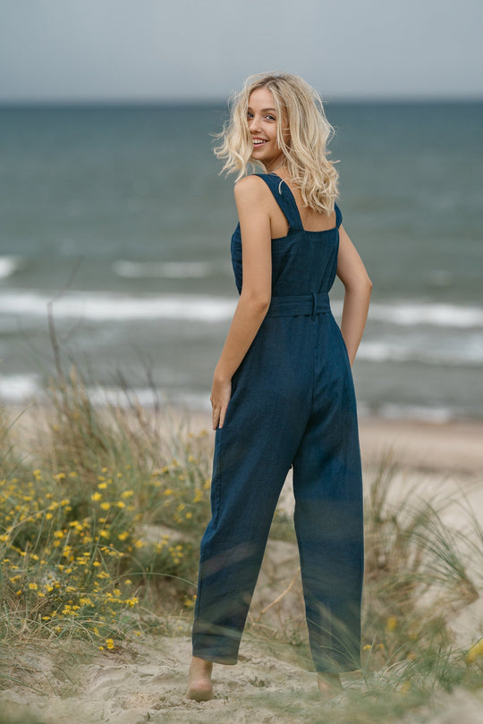 Model In Beach Demonstrates Linen Wrap Junpsuit Dicey In Midnight Blue Color 2 - Daily Linen