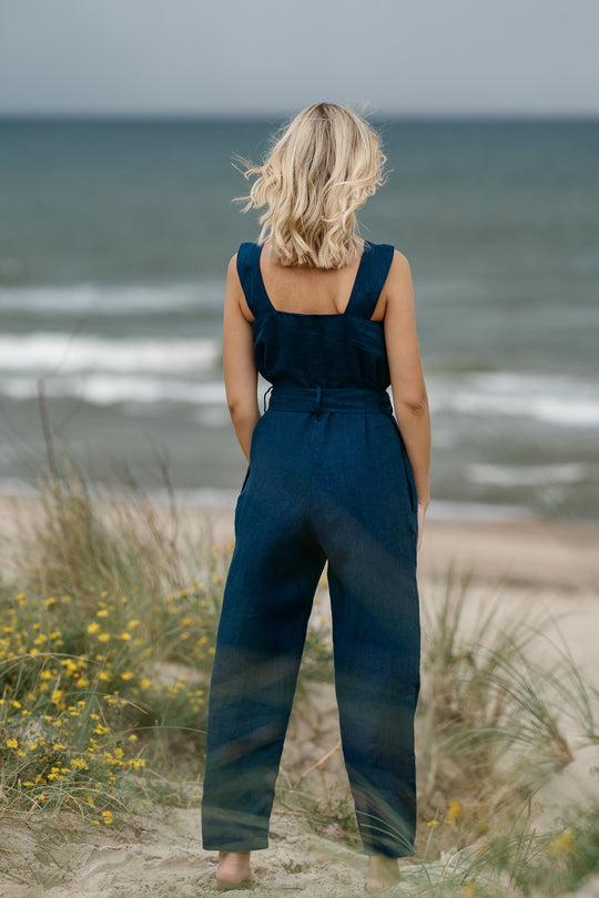 Model In Beach Demonstrates Linen Wrap Junpsuit Dicey In Midnight Blue Color 3 - Daily Linen