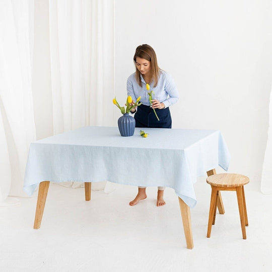 Women Serves Table With Linen Tablecloth In Sky Blue Color - Daily Linen