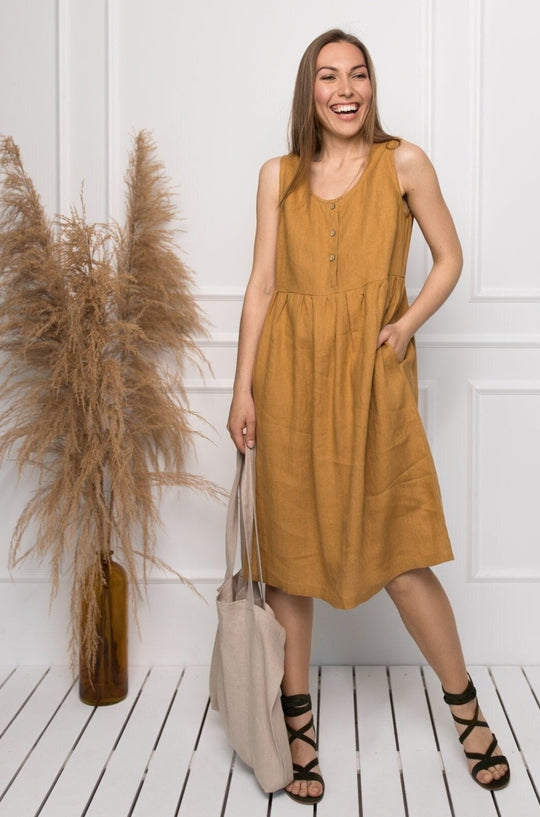 Model Wears Sleeveless Linen Dress Barbara In Amber Yellow Collor Made By Daily Linen