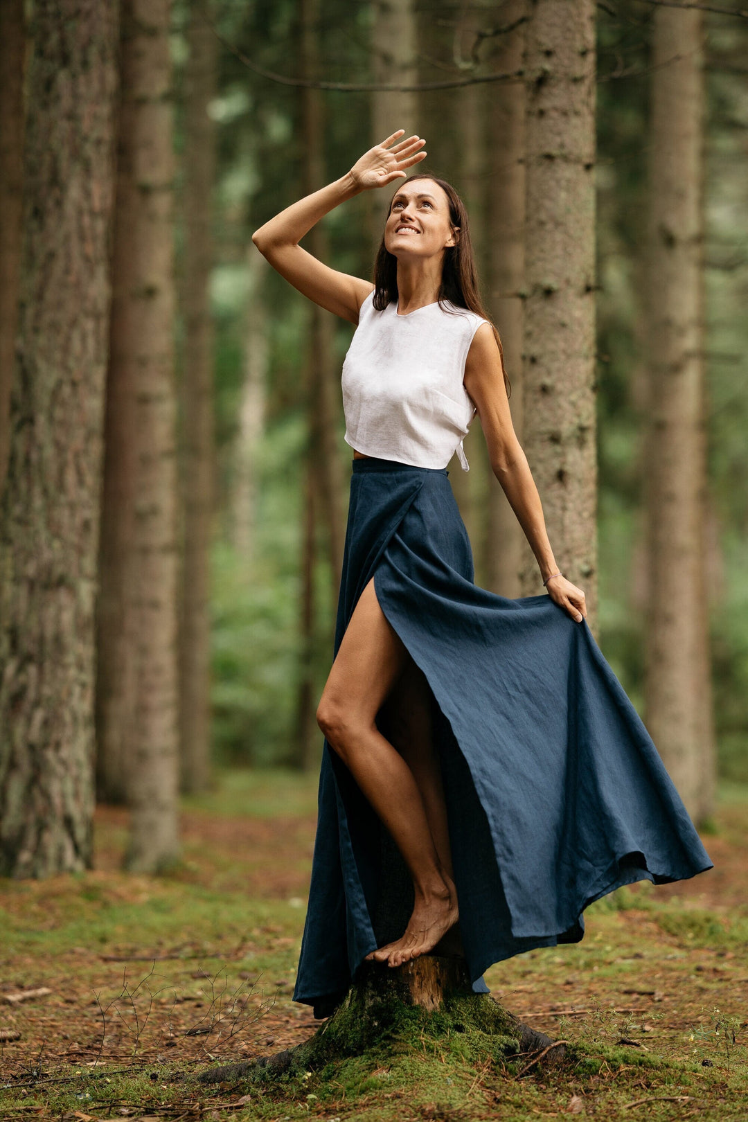 Model In Forest Wears Linen Wrap Maxi Skirt In Midnight Blue Color 2 - Daily Linen